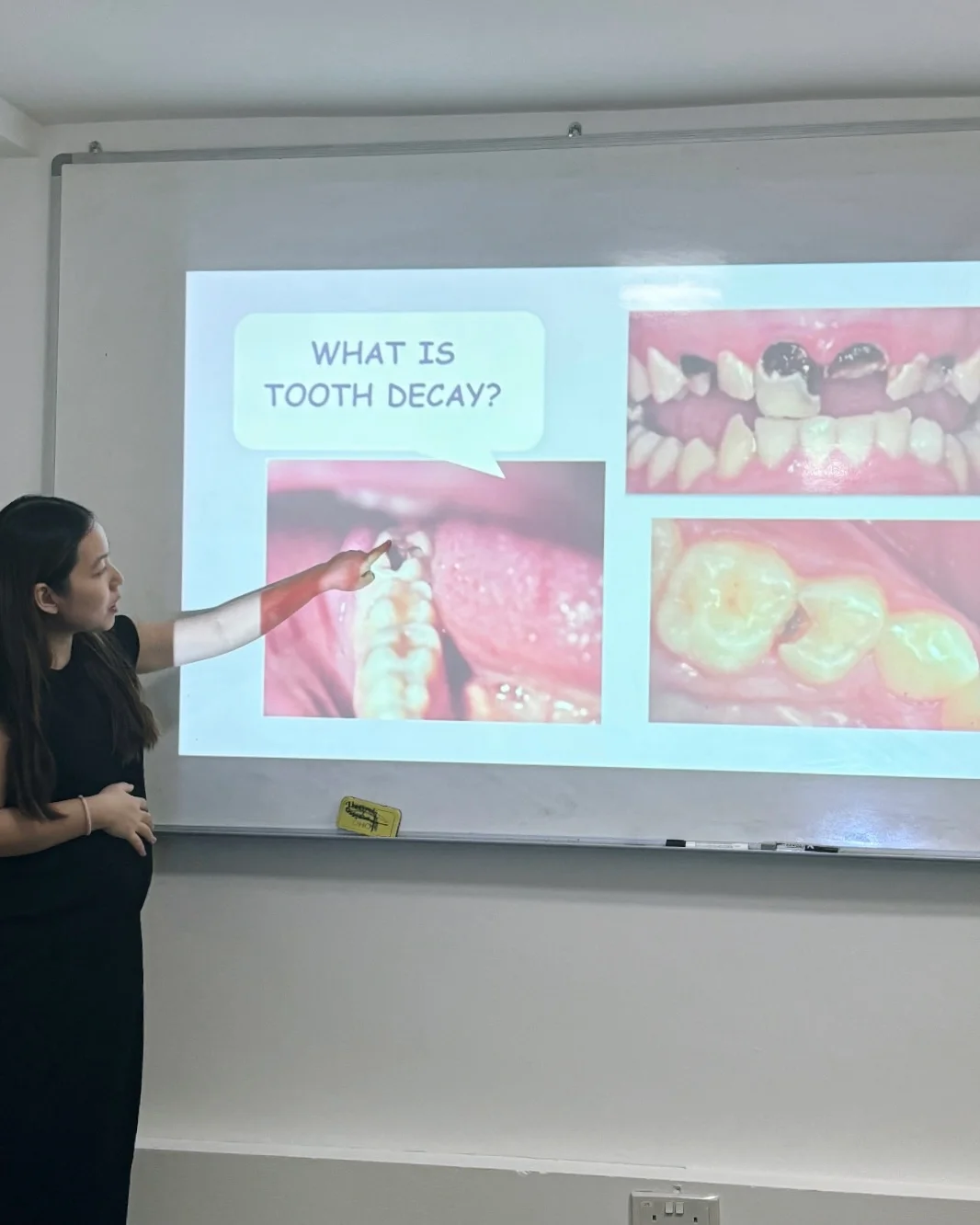 Kalinda Teo conducting an oral health presentation for children.